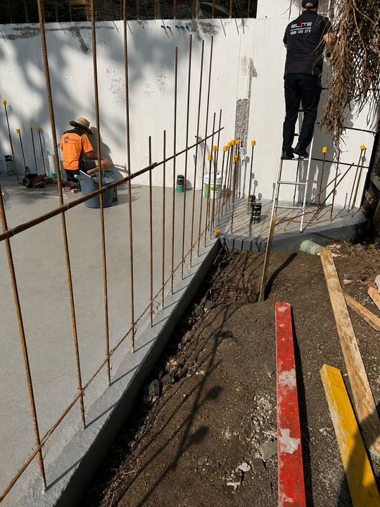 Our technician installing a pre-construction termite barrier